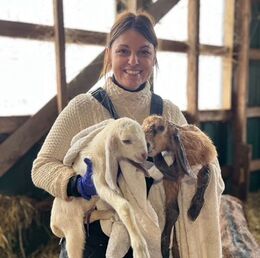 Farmer Flory with baby goats.